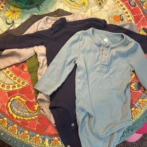 4-piece lot of long sleeved onesies for 3-6 months